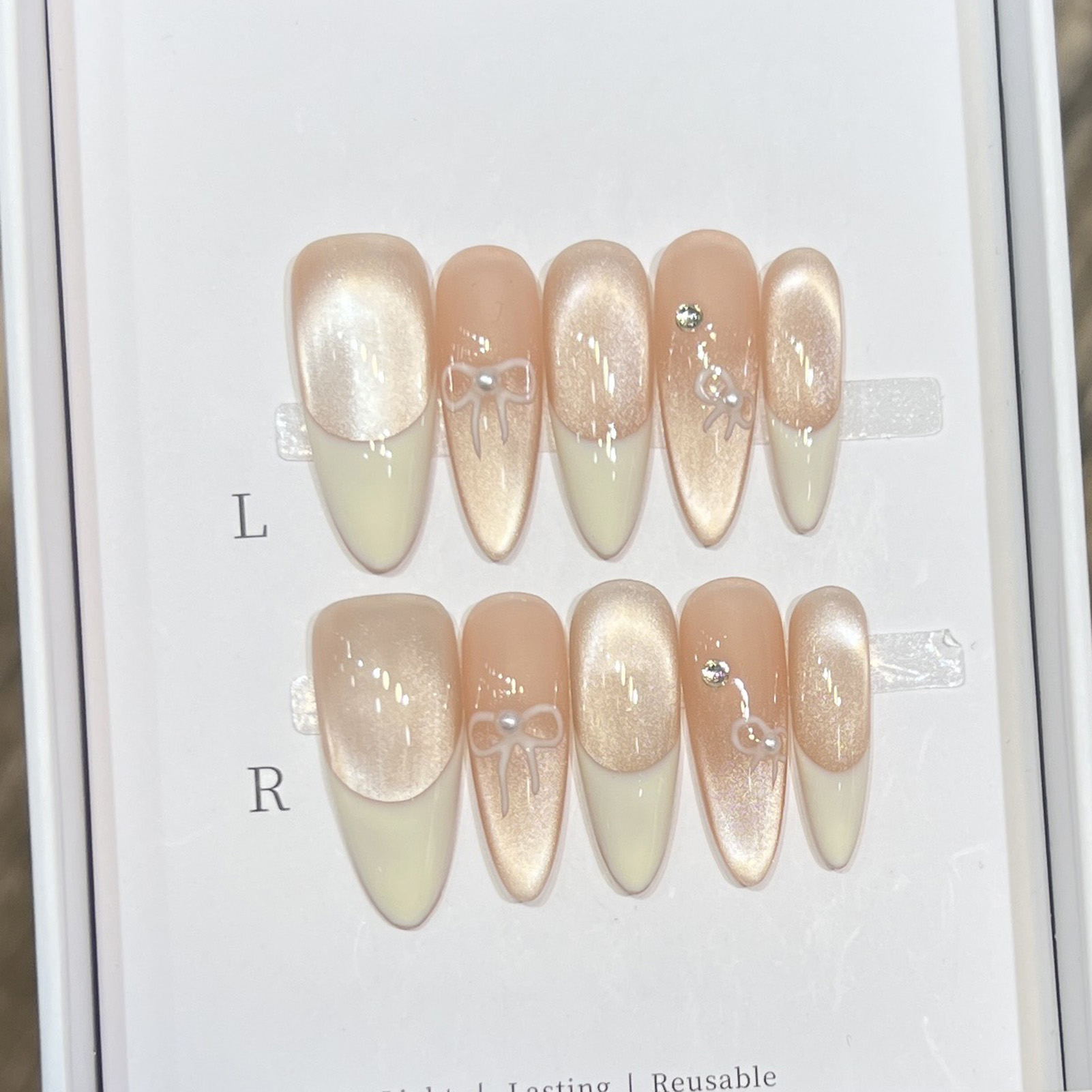 10 個アーモンド光沢のあるプレスオンネイルハートちょう結び - Nail Art Wedding のレビューと価格